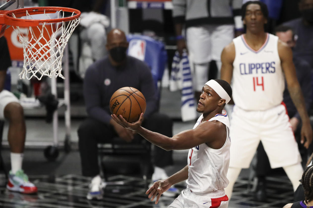 Rajon Rondo #4 of the LA Clippers drives to the basket against the Toronto Raptors in the first half at Staples Center on May 04, 2021 in Los Angeles, California. NOTE TO USER: User expressly acknowledges and agrees that, by downloading and or using this photograph, User is consenting to the terms and conditions of the Getty Images License Agreement. (Photo by Meg Oliphant/Getty Images)