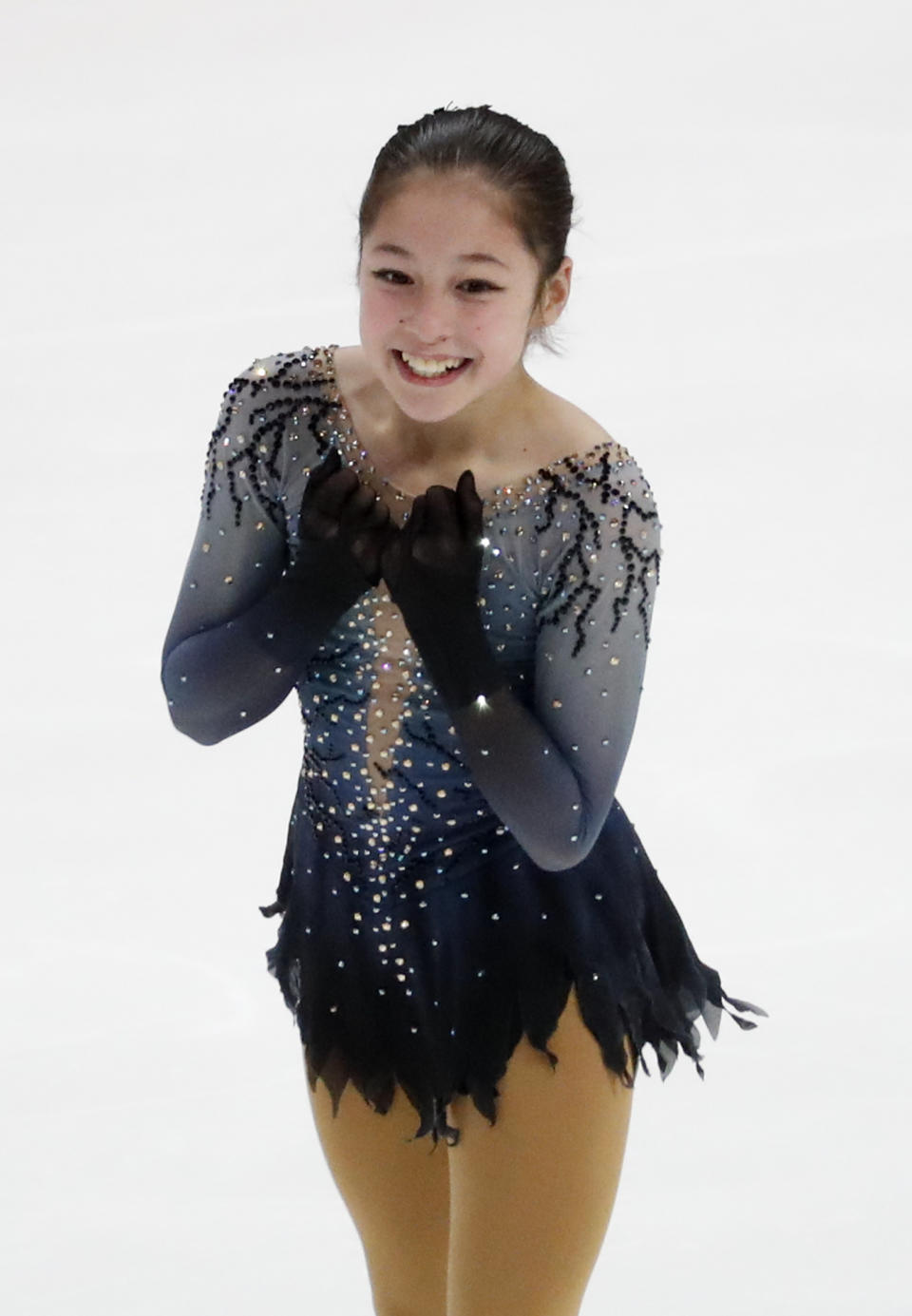 Alysa Liu reacts after performing her women's free skate program at the U.S. Figure Skating Championships, Friday, Jan. 25, 2019, in Detroit. (AP Photo/Paul Sancya)