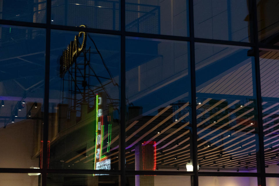 The lights of Cain's Ballroom reflect off the glass of the OKPOP Museum building in Tulsa on Saturday, May 7, 2022.