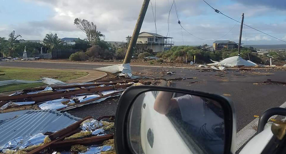 A driver captures debris littering the streets of Kalbarri after Cyclone Seroja.