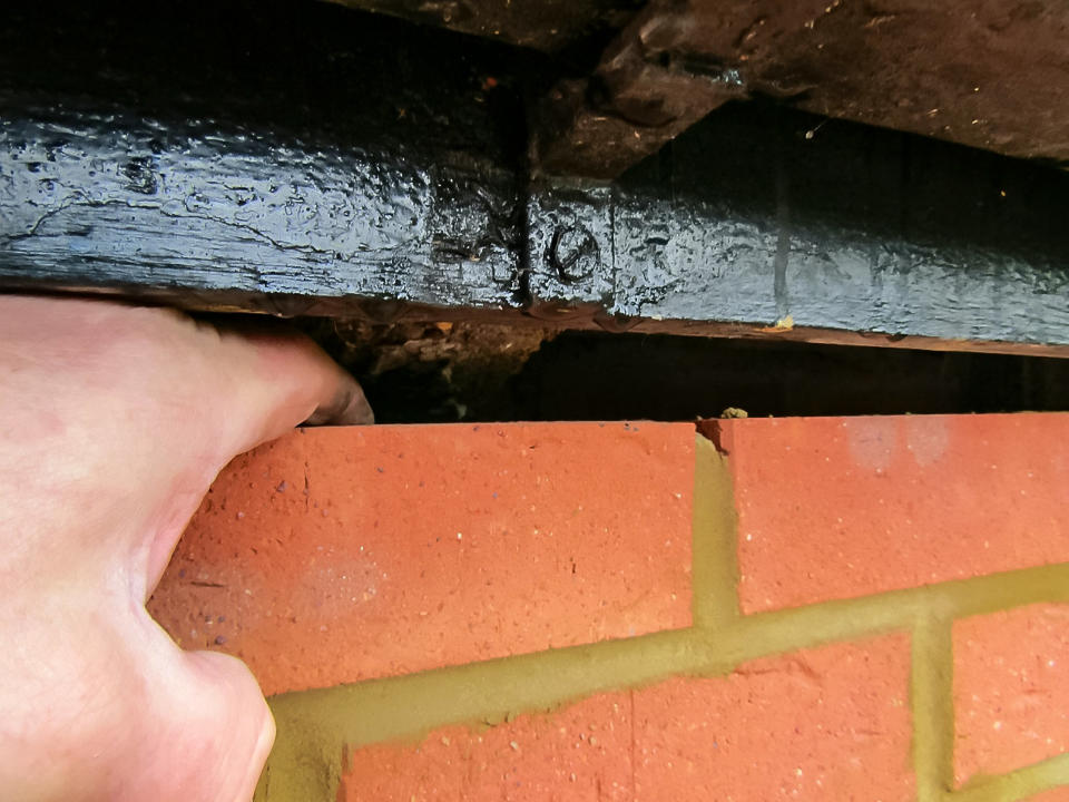 A gap between a section of the old building and the new brickwork. (SWNS)