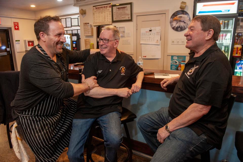 Bubba Bronzetti, left, with Job Lemieux and John Griffiths, both of the South Framingham Fraternal Order of Eagles, at the club, March 16, 2023. Bronzetti's Pizza and Kitchen is now offering food from the Eagles kitchen.