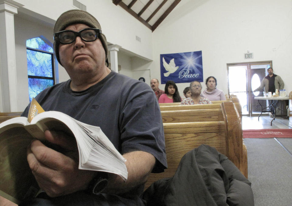 In this Thursday Jan. 30, 2014, photo, forklift driver William Felix, 56, attends a devotional at the Salvation Army in Los Banos, Calif. Now unemployed, Felix said that he has been to a local cannery four times this winter asking for work with no luck. He doubts a call will come at all this year, given the state’s drought. “If we don’t get rain, we don’t get work,” Felix said. For now, he relies on free food from the Salvation Army as well as a spiritual boost. (AP Photo/Scott Smith)