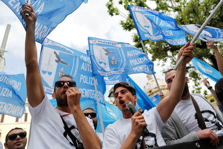 People, aspiring prison guards, protest in front of the Justice Ministery building in downtown Rome, Italy May 23, 2016. Reuters/Tony Gentile