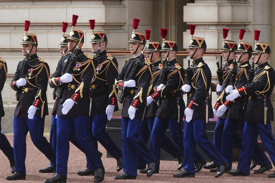 Troops from France's 1er Regiment de le Garde Republicaine partake in the Changing of the Guard ceremony at Buckingham Palace, to commemorate the 120th anniversary of the Entente Cordiale - the historic diplomatic agreement between Britain and France which laid the groundwork for their collaboration in both world wars, in London, Monday, April 8, 2024. France is the first non-Commonwealth country to take part in the Changing of the Guard. (Victoria Jones/Pool Photo via AP)
