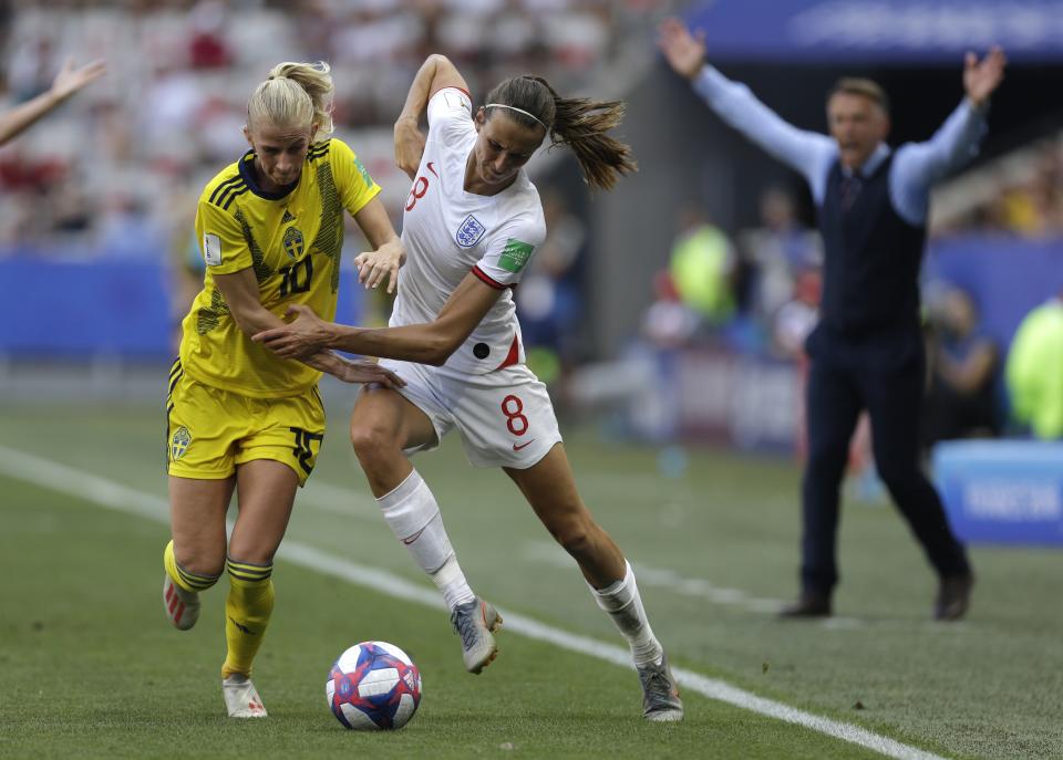 Sweden's Sofia Jakobsson, left, and England's Jill Scott challenge for the ball during the Women's World Cup third place soccer match between England and Sweden at Stade de Nice, in Nice, France, Saturday, July 6, 2019. (AP Photo/Claude Paris)