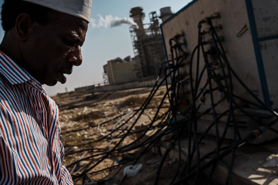 Yusef Zayadeen inspects the water pipes that connect unrecognized settlements