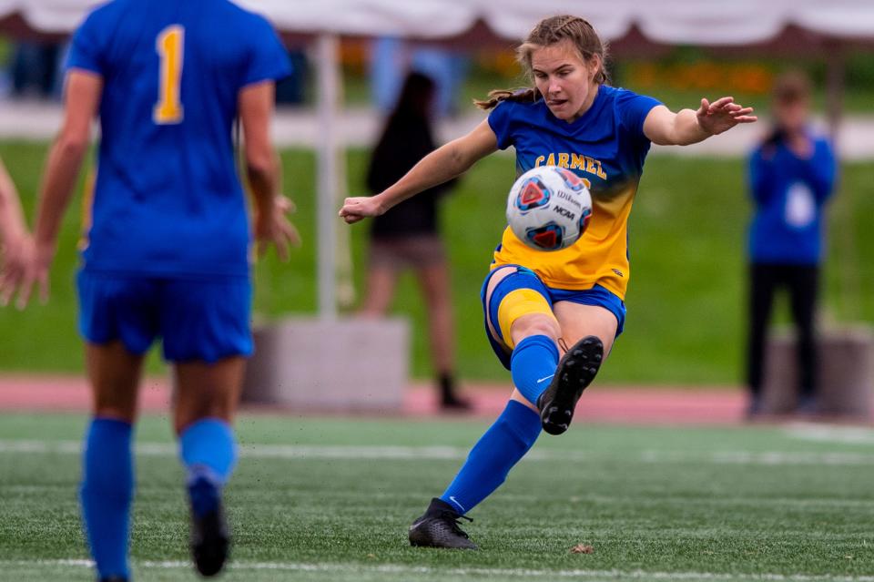 Carmel High School senior Emily Roper (26) puts a futon the ball during the first half of an IHSAA class 3A girls’ soccer State Championship match against Homestead High School, Saturday, Oct. 30, 2021, at IUPUI’s Michael A. Carroll Track and Soccer Stadium in Indianapolis.