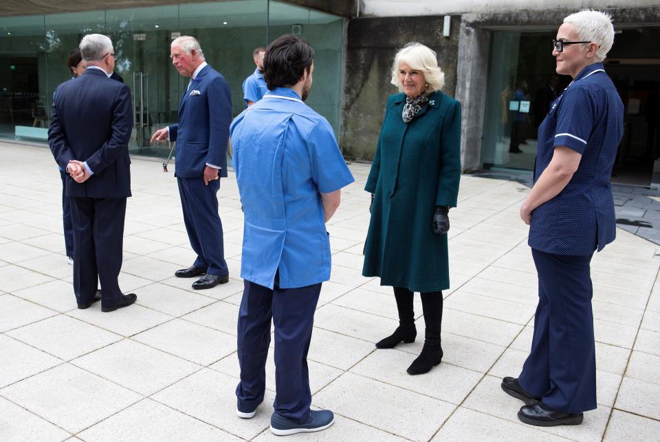 Britain's Prince Charles, Prince of Wales (2L) and his wife Britain's Camilla, Duchess of Cornwall (2R) meet with nurses and midwives from Belfast Health and Social Care Trust, who transitioned early from Queen's University Belfast and the Open University, into clinical roles to support and respond to the COVID-19 pandemic, during their visit to the Ulster Museum in Belfast on September 30, 2020. (Photo by Ian Vogler / POOL / AFP) (Photo by IAN VOGLER/POOL/AFP via Getty Images)