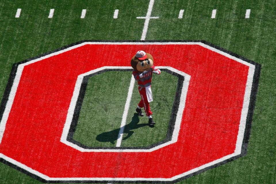 (KEK OSUY 8/30/2008) Ohio State mascot Brutus Buckeye leads the cheers at the center of the field on Saturday, August 30 at the OSU vs. Youngstown State game in Ohio Stadium. (Dispatch photo by Karl Kuntz)