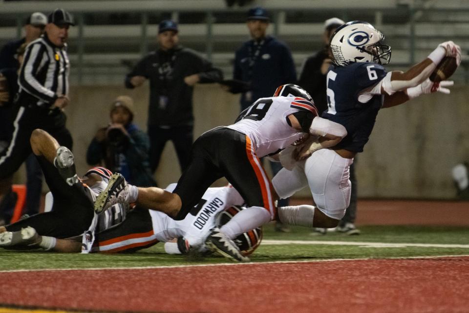 Central Valley Christian's Bryson Donelson dives into the endzone against Los Gatos during the CIF State Football Championship at Pasadena City College in Pasadena CA on Saturday, Dec. 09, 2023. Central Valley Christian leads 24-7 at halftime.