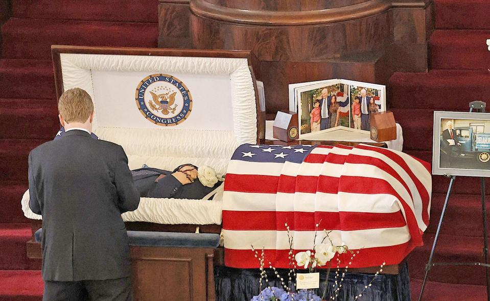 Joseph Kennedy III pays his respects to former Congressman William Delahunt during a wake for the Quincy Democrat at the historic United First Parish Church - "Church of Presidents" - in Quincy Square on Friday, April 5, 2024.