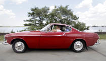 Irv Gordon drives his Volvo P1800 in Babylon, N.Y., Monday, July 2, 2012. Gordon's car already holds the world record for the highest recorded milage on a car and he is less than 40,000 miles away from passing three million miles on the Volvo. (AP Photo/Seth Wenig)