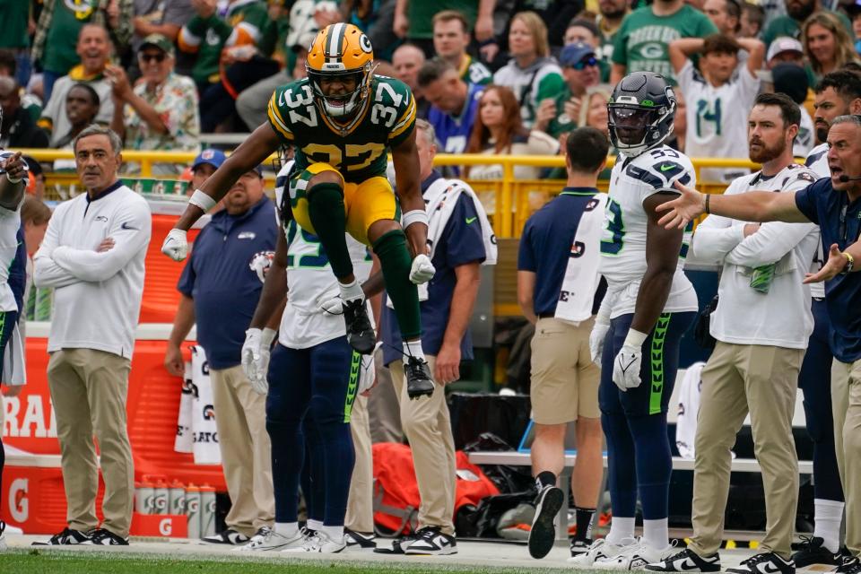 Green Bay Packers cornerback Carrington Valentine (37) reacts after breaking up a pass during a preseason NFL football game against the Seattle Seahawks, Saturday, Aug. 26, 2023, in Green Bay, Wis.