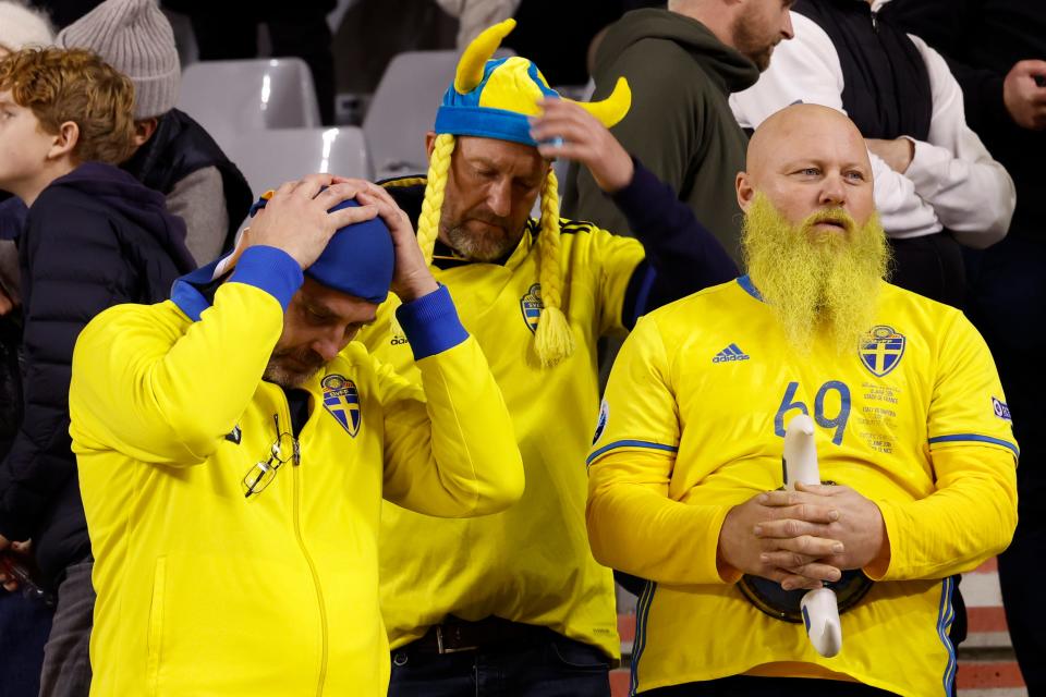 Sweden supporters wait on the stands after suspension of the Euro 2024 qualifying soccer match at the King Baudouin Stadium in Brussels, Belgium.