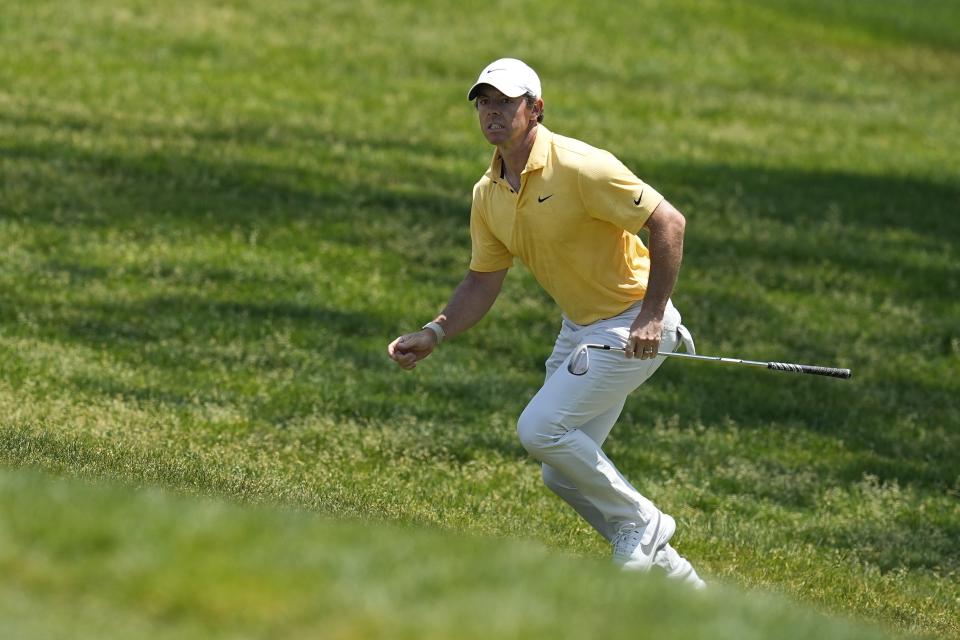 Rory McIlroy, of Northern Ireland, runs up a hill to look at his hit on the fourth hole during the final round of the Memorial golf tournament, Sunday, June 4, 2023, in Dublin, Ohio. (AP Photo/Darron Cummings)