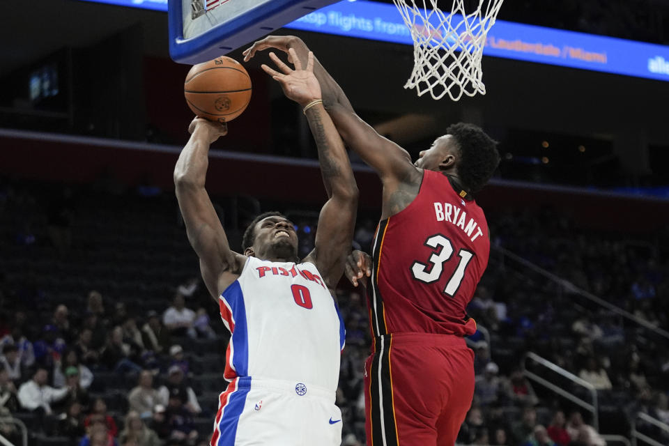 Detroit Pistons center Jalen Duren (0) shoots on Miami Heat center Thomas Bryant (31) in the first half of an NBA basketball game in Detroit, Sunday, March 17, 2024. (AP Photo/Paul Sancya)