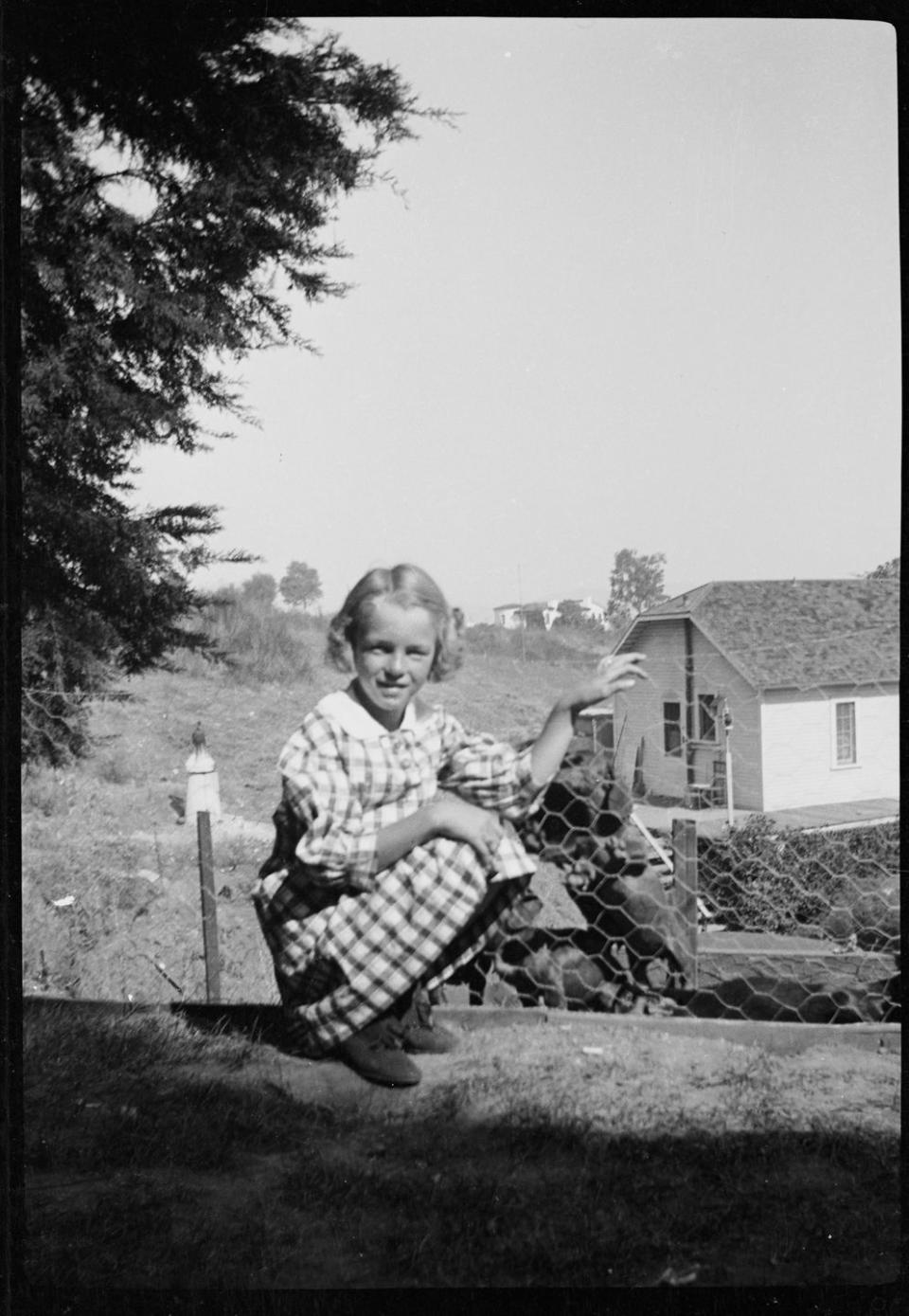 1933: Playing with neighborhood dogs