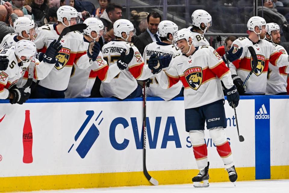 Jan 27, 2024; Elmont, New York, USA; Florida Panthers center Sam Reinhart (13) celebrates his goal against the New York Islanders with the Florida Panthers bench during the second period at UBS Arena.
