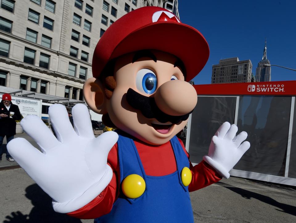 Mario from Super Mario Bros. poses for pictures as the Nintendo Switch is unveiled at  a pop-up Living room in Madison Square Park in New York on March 3, 2017.
Nintendo Switch is a first-of-its-kind video game system where you can play at home and take it on-the-go. / AFP PHOTO / TIMOTHY A. CLARY        (Photo credit should read TIMOTHY A. CLARY/AFP/Getty Images)