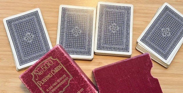 A set of early 20th-century playing cards bearing images of a swastika are among the items, including poker chips and discount coins, collected by Holocaust historian Jeff Kelman of New Hampshire. Before the swastika was misappropriated by Nazi Germany, Kelman said, it was an ancient symbol of wellbeing and good luck.