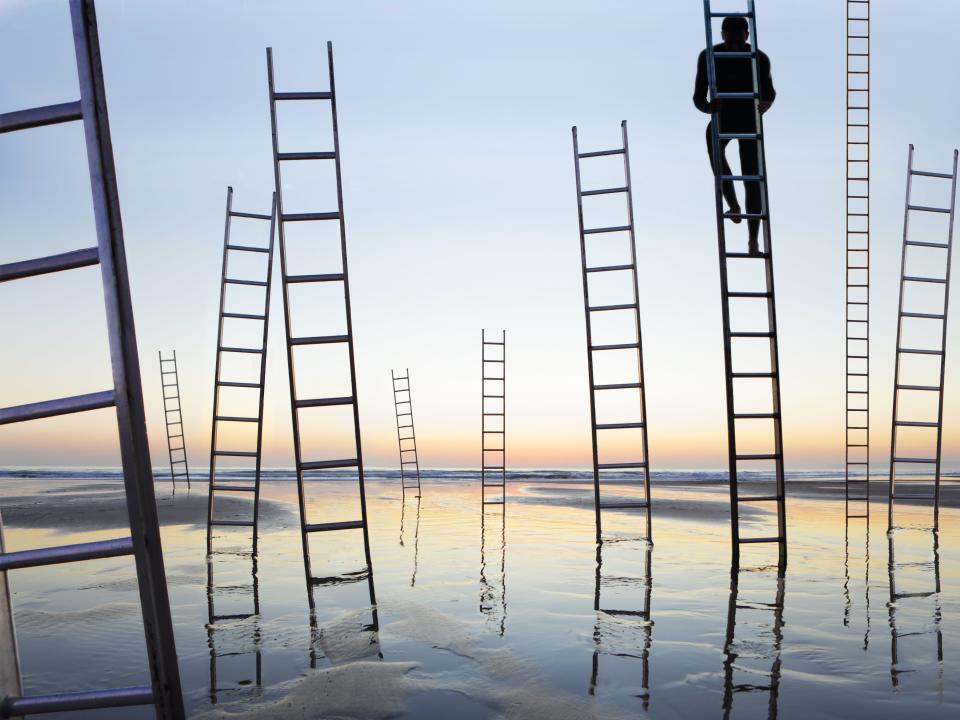 A conceptual photo of a man on a career ladder.