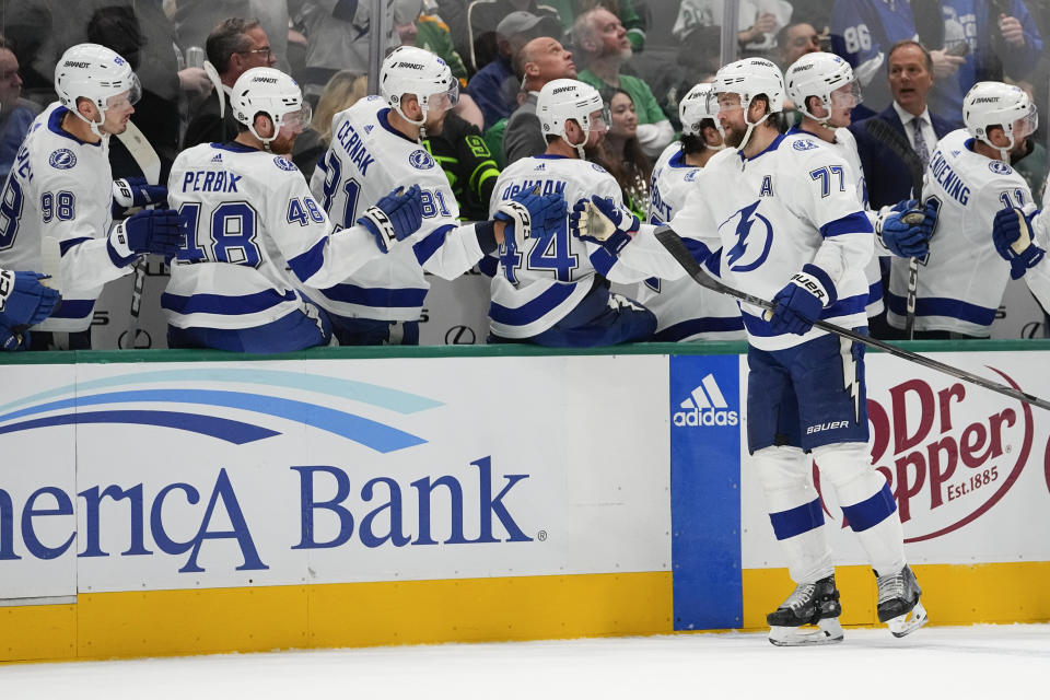 Tampa Bay Lightning defenseman Victor Hedman (77) skates by his bench after scoring a goal against the Dallas Stars during the first period of an NHL hockey game, Saturday, Dec. 2, 2023, in Dallas. (AP Photo/Julio Cortez)