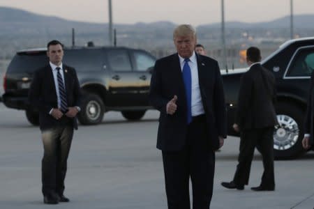 U.S. President Donald Trump arrives for a campaign rally at the airport in Las Vegas, Nevada, U.S., September 20, 2018.   REUTERS/Mike Segar