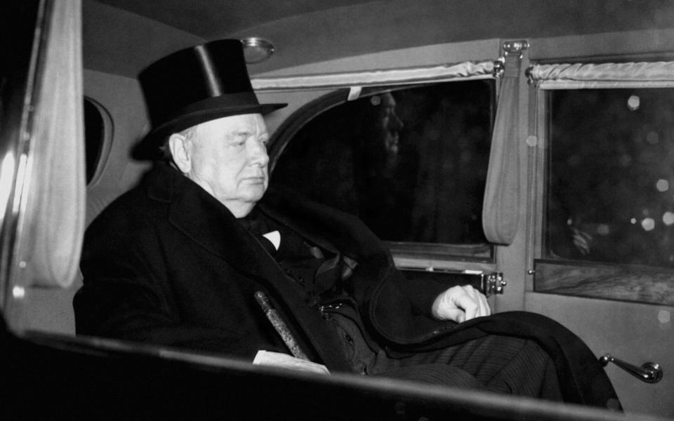 His face reflecting the grief of the nation at the King's death, Prime Minister Winston Churchill leaves St. James' Palace, London, after attending the Privy Council meeting, automatically summoned on the death of the Sovereign and known as the Accession Council. - PA/PA Archive