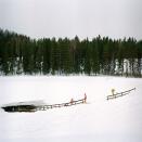 Three men using Vuorilammen sauna ice swimming hole, Jyväskylä, Finland. <br><br>Camera: Hasselblad 503 <br><br>Tessa Bunney, UK <br><br>Commended, Cultures & Traditions portfolio