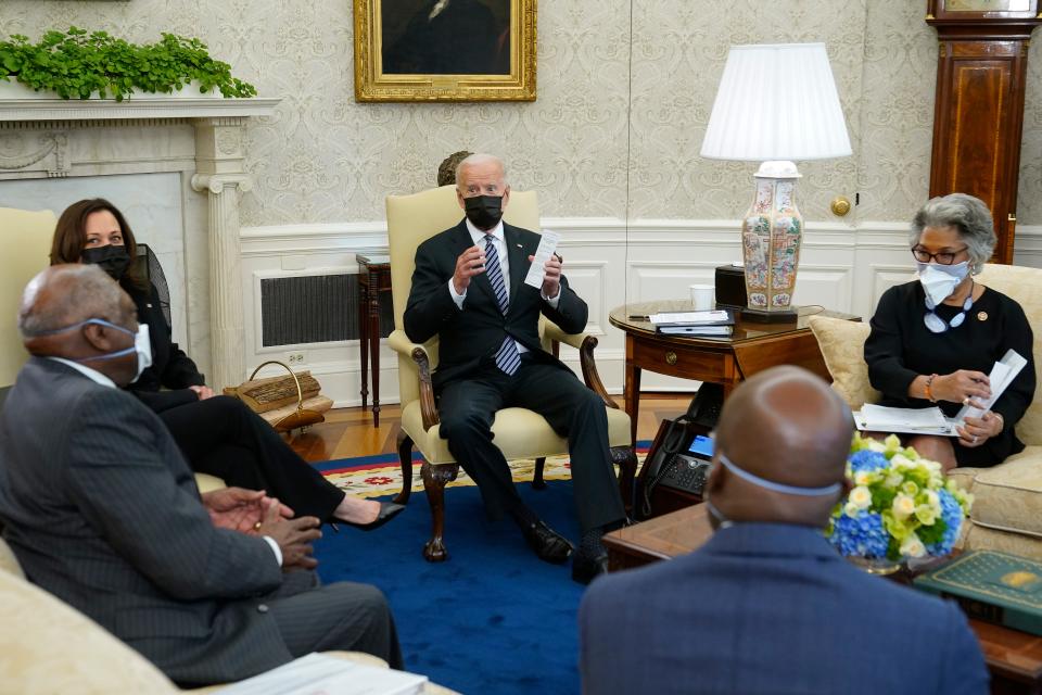 President Joe Biden speaks as he and Vice President Kamala Harris meet with members of the Congressional Black Caucus in the Oval Office of the White House, Tuesday, April 13, 2021, in Washington. Sitting are House Majority Whip James Clyburn, of S.C., from left, Sen. Raphael Warnock, D-Ga., and Rep. Joyce Beatty, D-Ohio.