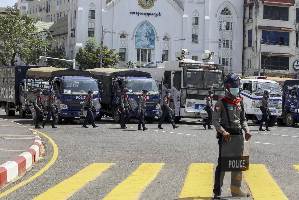 Riot policeman stand guarding outside Yangon City Hall during a protest against the military coup in Yangon, Myanmar Wednesday, Feb. 17, 2021. The U.N. expert on human rights in Myanmar warned of the prospect for major violence as demonstrators gather again Wednesday to protest the military's seizure of power. (AP Photo)