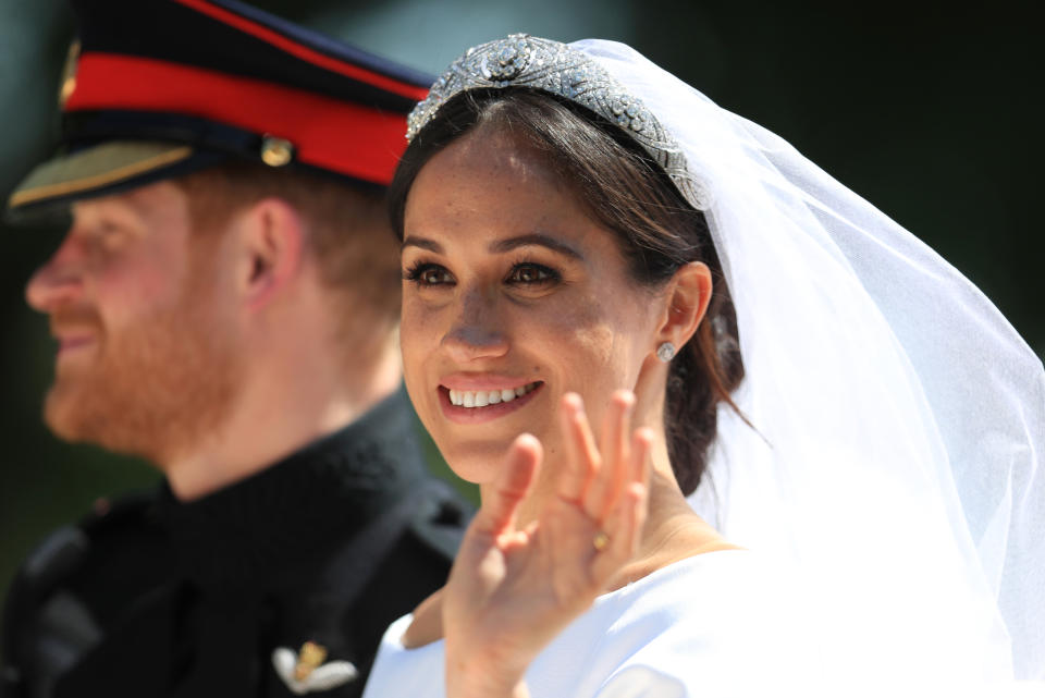 Prince Harry and Meghan Markle ride in an Ascot Landau after their wedding at Windsor Castle in the United Kingdom on May 19, 2018.