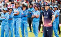 Cricket - Women's Cricket World Cup Final - England vs India - London, Britain - July 23, 2017 England's Anya Shrubsole looks on at the end of the match as India players look dejected Action Images via Reuters/John Sibley