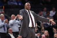 Georgetown head coach Patrick Ewing encourages the crowd to get behind his team during the second half of the first round of the 2K Empire Classic NCAA college basketball tournament, Thursday, Nov. 21, 2019, in New York. Georgetown defeated Texas 82-66. (AP Photo/Kathy Willens)