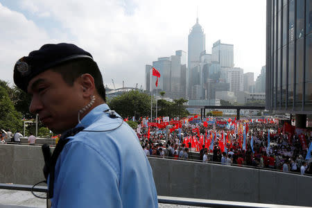 A policeman on patrol as thousands of pro-China protesters demonstrate outside the Legislative Council in Hong Kong, China October 26, 2016. REUTERS/Bobby Yip