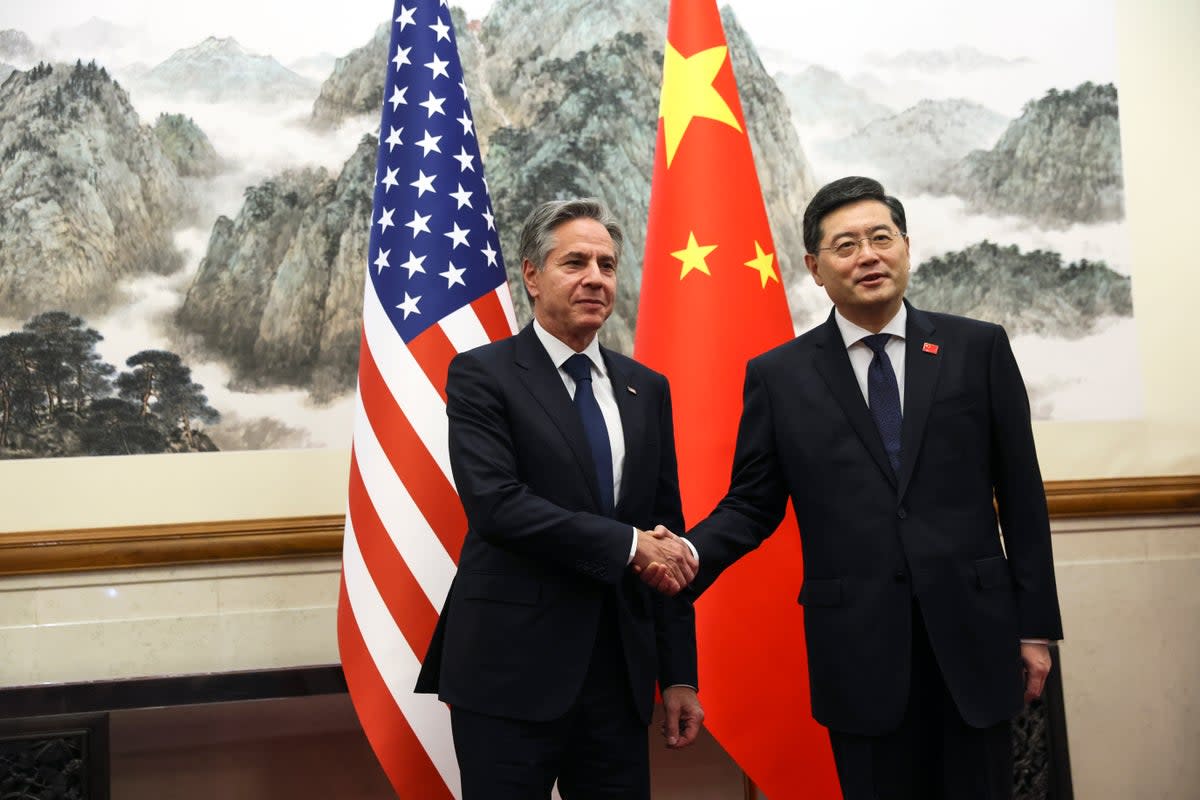 US secretary of state Antony Blinken, left, shakes hands with Chinese foreign minister Qin Gang, right, at the Diaoyutai State Guest house in Beijing, China on Sunday  (AP)
