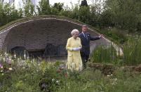 <p>Prince Charles shows his mother around The Healing Garden in 2002. The garden was dedicated to the Queen Mother.</p>