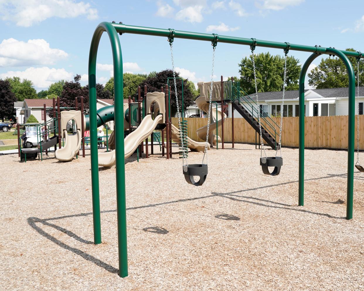 The newly constructed and installed community playground at Hidden River North in Adrian is pictured Thursday afternoon. The playground features a jungle gym with several amenities such as a steering wheel and running tunnels, five slides of various heights and lengths and a set of swings.