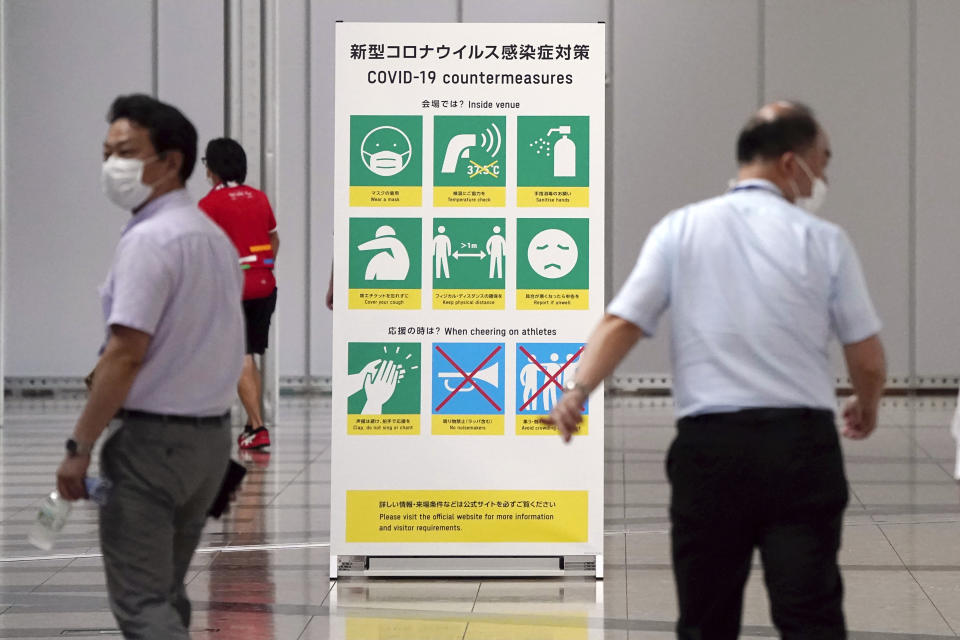 A sign for COVID-19 countermeasures is placed at Main Press Center (MPC) for Tokyo 2020 Olympic Games at Tokyo Big Site Friday, July 2, 2021, in Tokyo. (AP Photo/Shuji Kajiyama)