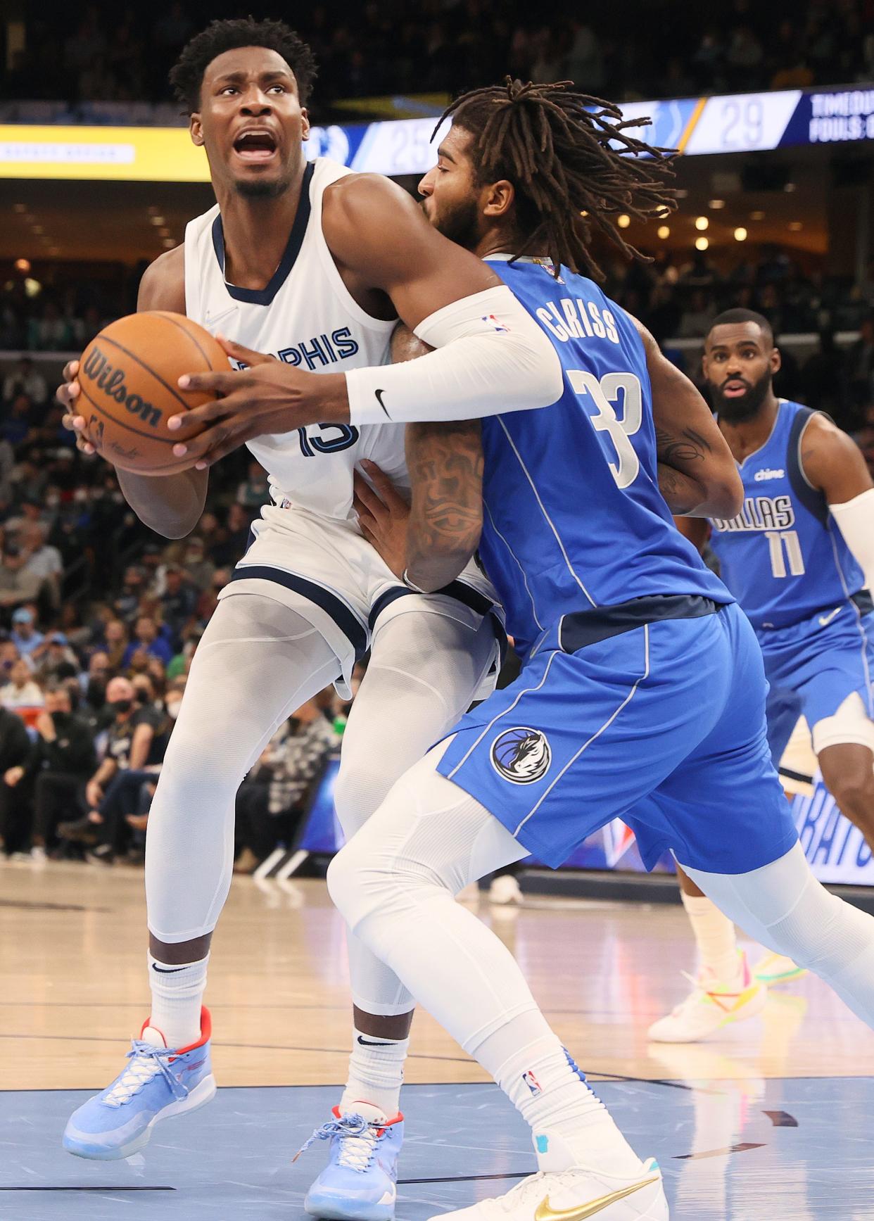 Memphis Grizzlies forward Jaren Jackson Jr. spins past the defense of Dallas Mavericks forward Marquese Chriss at FedexForum on Friday, Jan. 14, 2022.