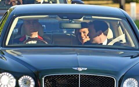 The Duke of York drives his daughters Princess Beatrice, Princess Eugenie and Eugenie's fiancee Jack Brooksbank to the venue in a Bentley - Credit: Steve Finn for The Telegraph