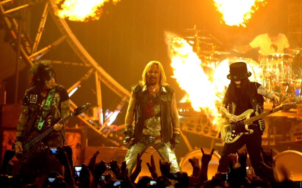 Motley Crue performing in 2011; the band are supposed to reunite next year - Getty