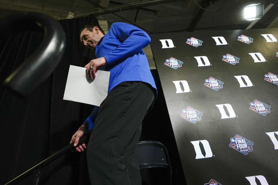 Duke head coach Mike Krzyzewski leaves a news conference after his team's loss against North Carolina during a college basketball game in the semifinal round of the Men's Final Four NCAA tournament, Saturday, April 2, 2022, in New Orleans. (AP Photo/David J. Phillip)