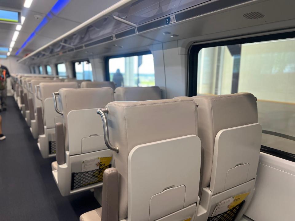 The regular coach seats inside the Brightline.