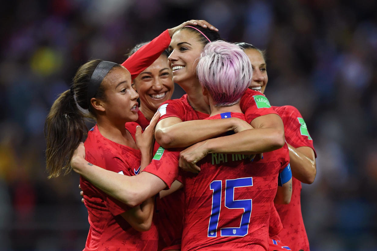 REIMS, FRANCE - JUNE 11: Alex Morgan of the USA celebrates with teammates after scoring her team's twelfth goal during the 2019 FIFA Women's World Cup France group F match between USA and Thailand at Stade Auguste Delaune on June 11, 2019 in Reims, France. (Photo by Alex Caparros - FIFA/FIFA via Getty Images)