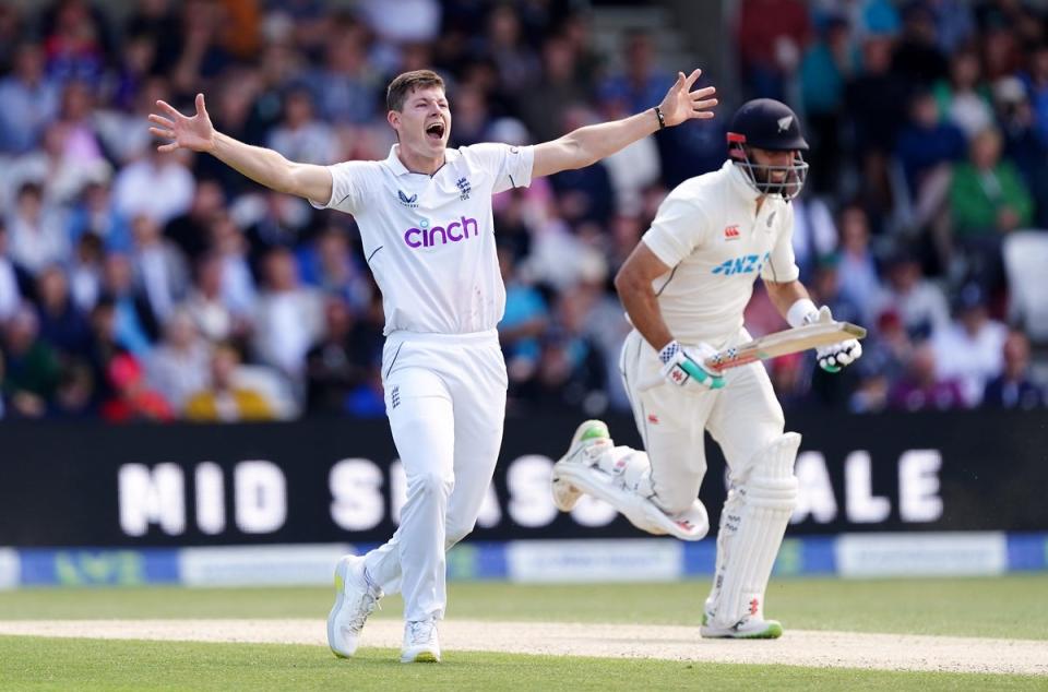 Matthew Potts celebrates the wicket of in-form New Zealand batter Daryl Mitchell (PA Wire)
