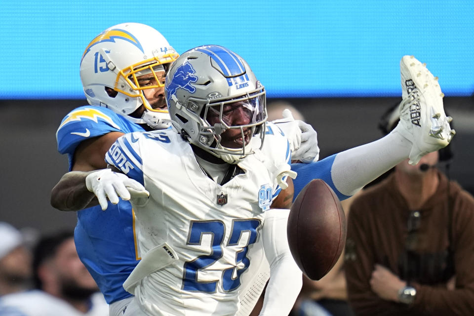 Detroit Lions cornerback Jerry Jacobs (23) breaks up a pass intended for Los Angeles Chargers wide receiver Jalen Guyton (15) during the first half an NFL football game Sunday, Nov. 12, 2023, in Inglewood, Calif. (AP Photo/Gregory Bull)