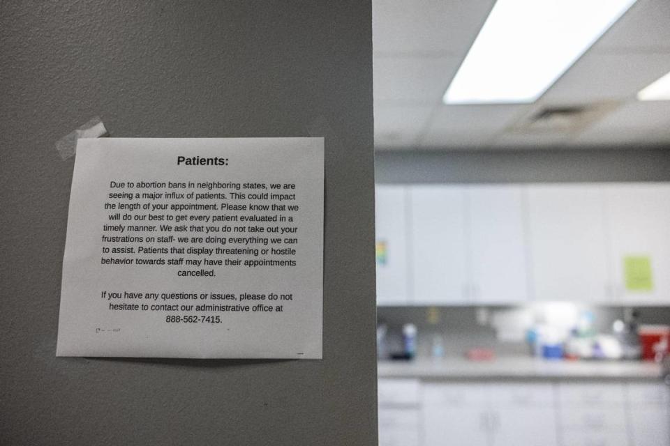 One of several signs posted on walls throughout Charlotte’s A Preferred Women’s Health Center reflects the increase in patients since Roe v. Wade was overturned in 2022.