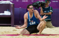 Canada's Joshua Binstock argues an out-of-bounds call during preliminary beach volleyball action against Tarjei Viken Skarlund and Martin Spinnangr at the 2012 London Olympics, on July 30, 2012. Binstock and his partner Martin Reader lost two sets to none.